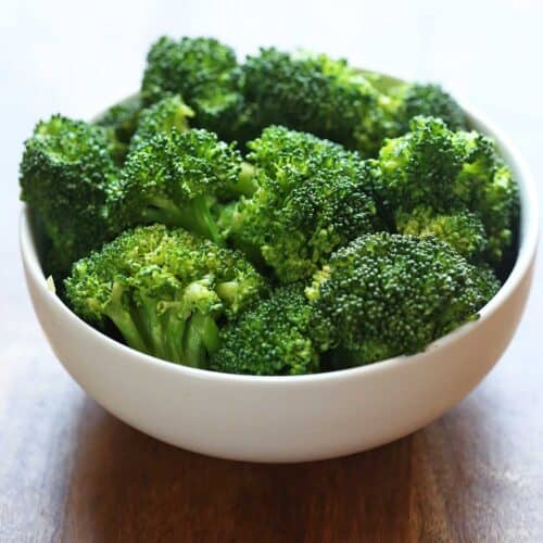 Microwave broccoli is served in a white bowl.