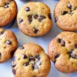 Almond flour chocolate chip muffins are served on a white plate.