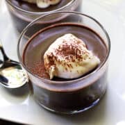 Keto pudding is topped with whipped cream.