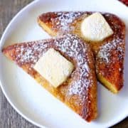 Keto French toast is topped with butter.