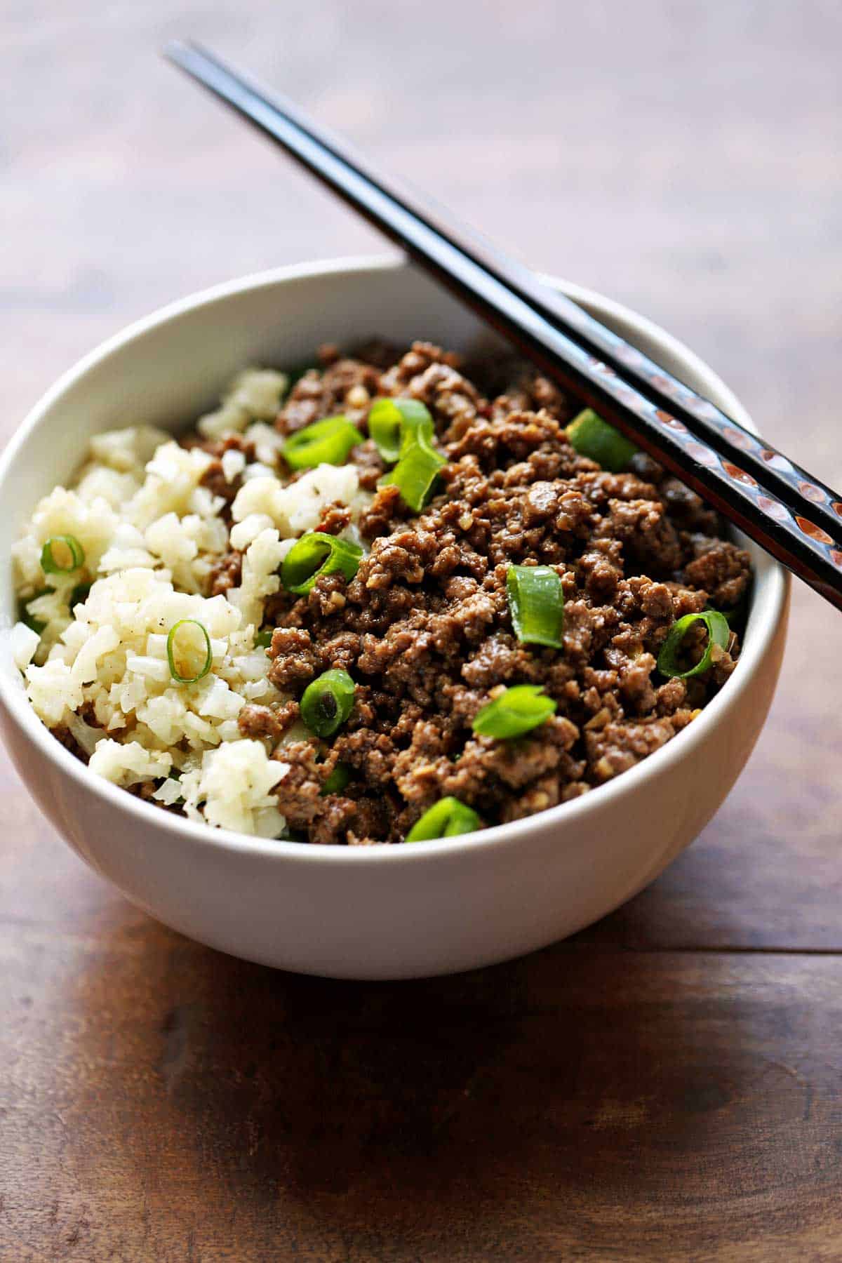 Korean ground beef is served with chopsticks. 