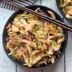 Chinese chicken salad is served with chopsticks.