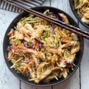 Chinese chicken salad is served with chopsticks.