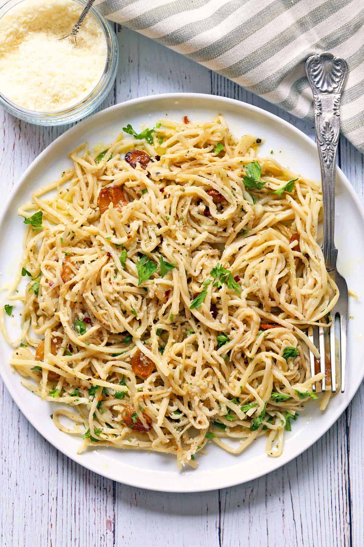 Hearts of palm pasta is served with grated parmesan cheese. 