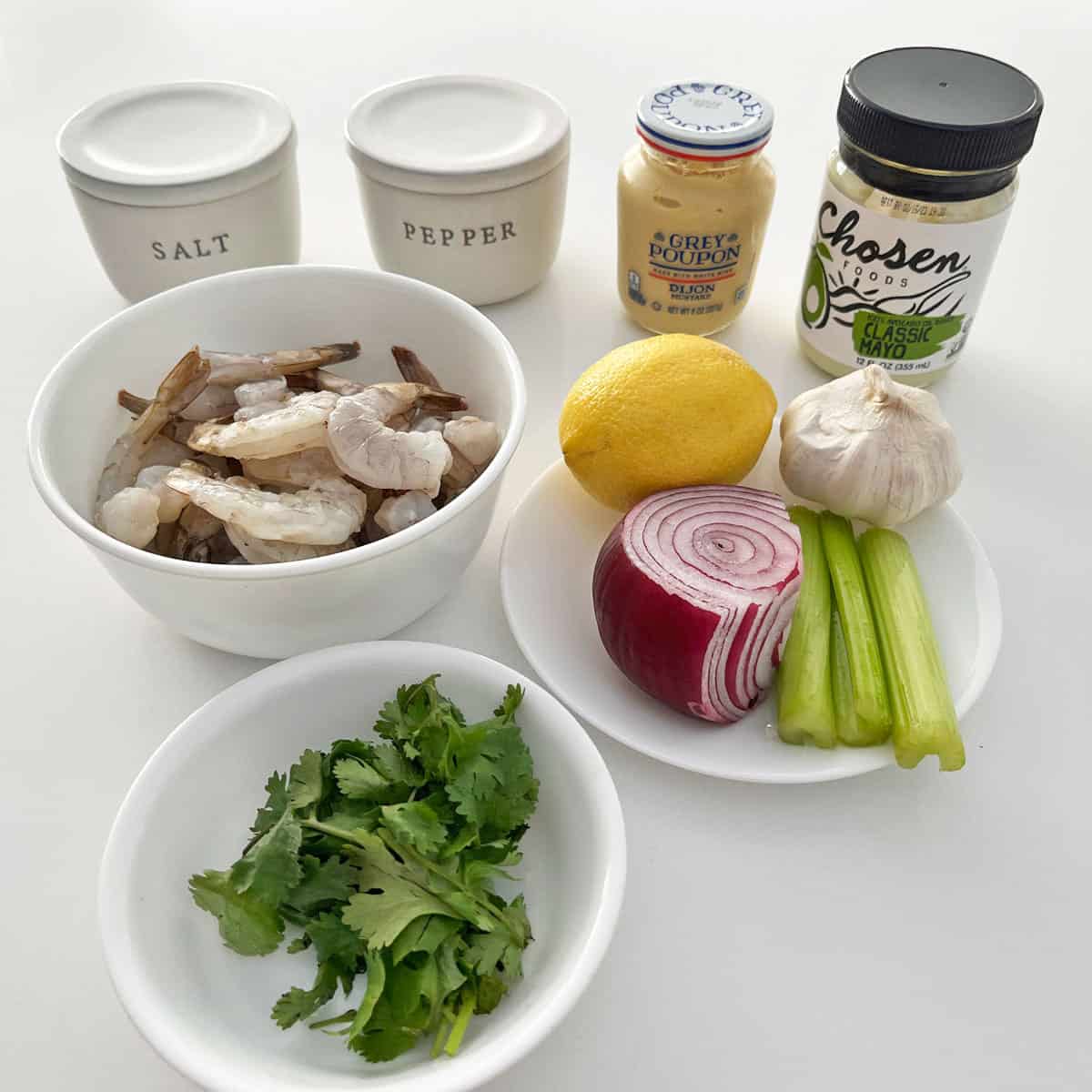 The ingredients needed for making a shrimp salad. 