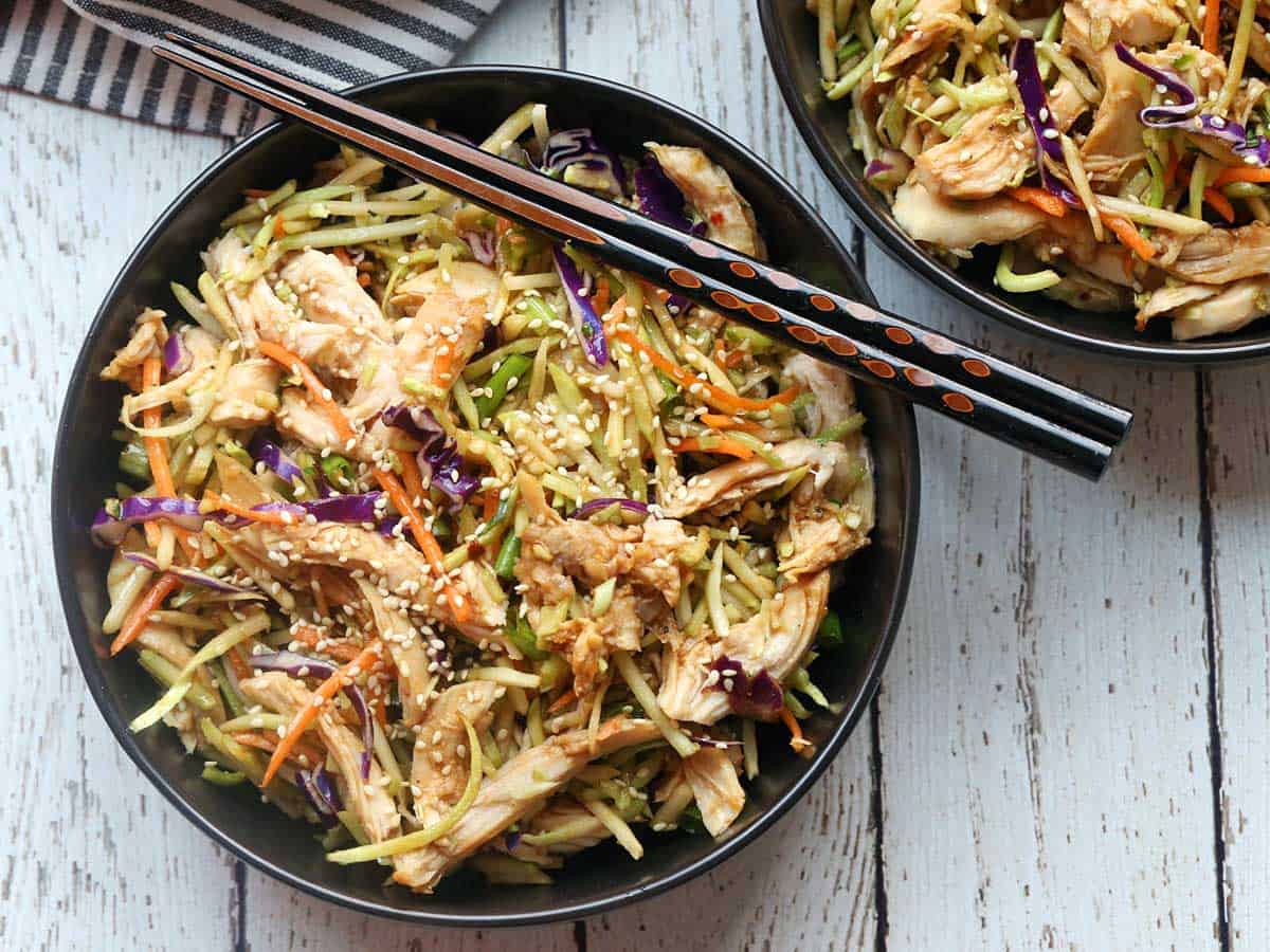 Chinese chicken salad is served with chopsticks. 