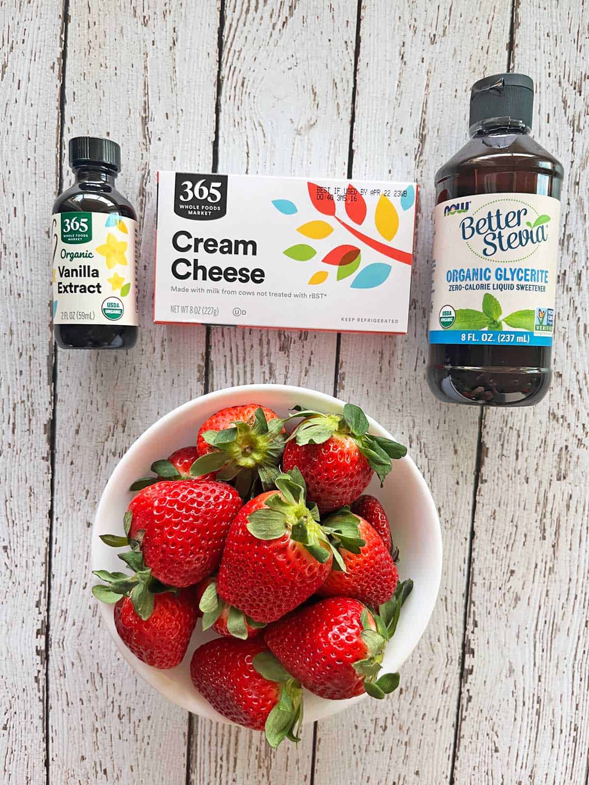 The ingredients needed for making cheesecake-stuffed strawberries. 