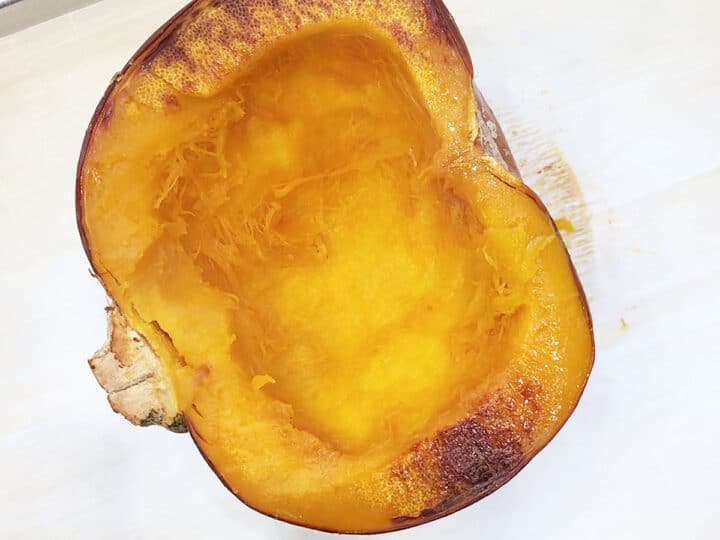 A baked pumpkin half is ready.