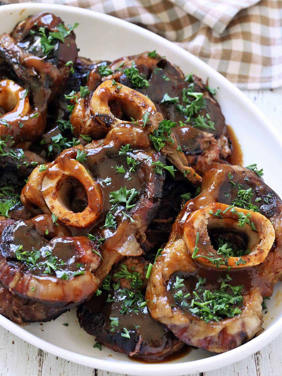 Beef shanks are served on a platter.