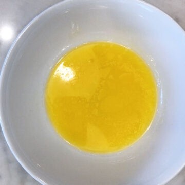 Melted butter in a bowl.