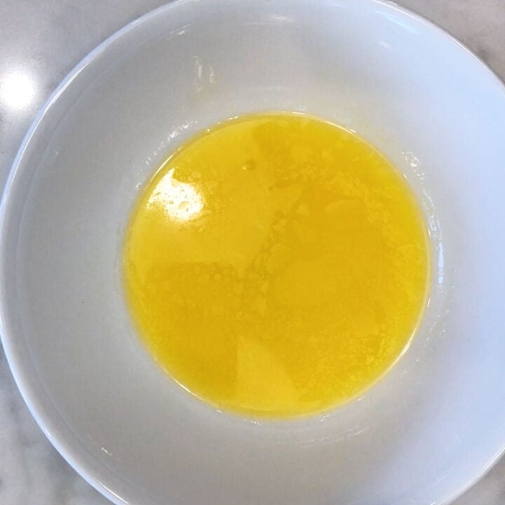 Melted butter in a bowl.