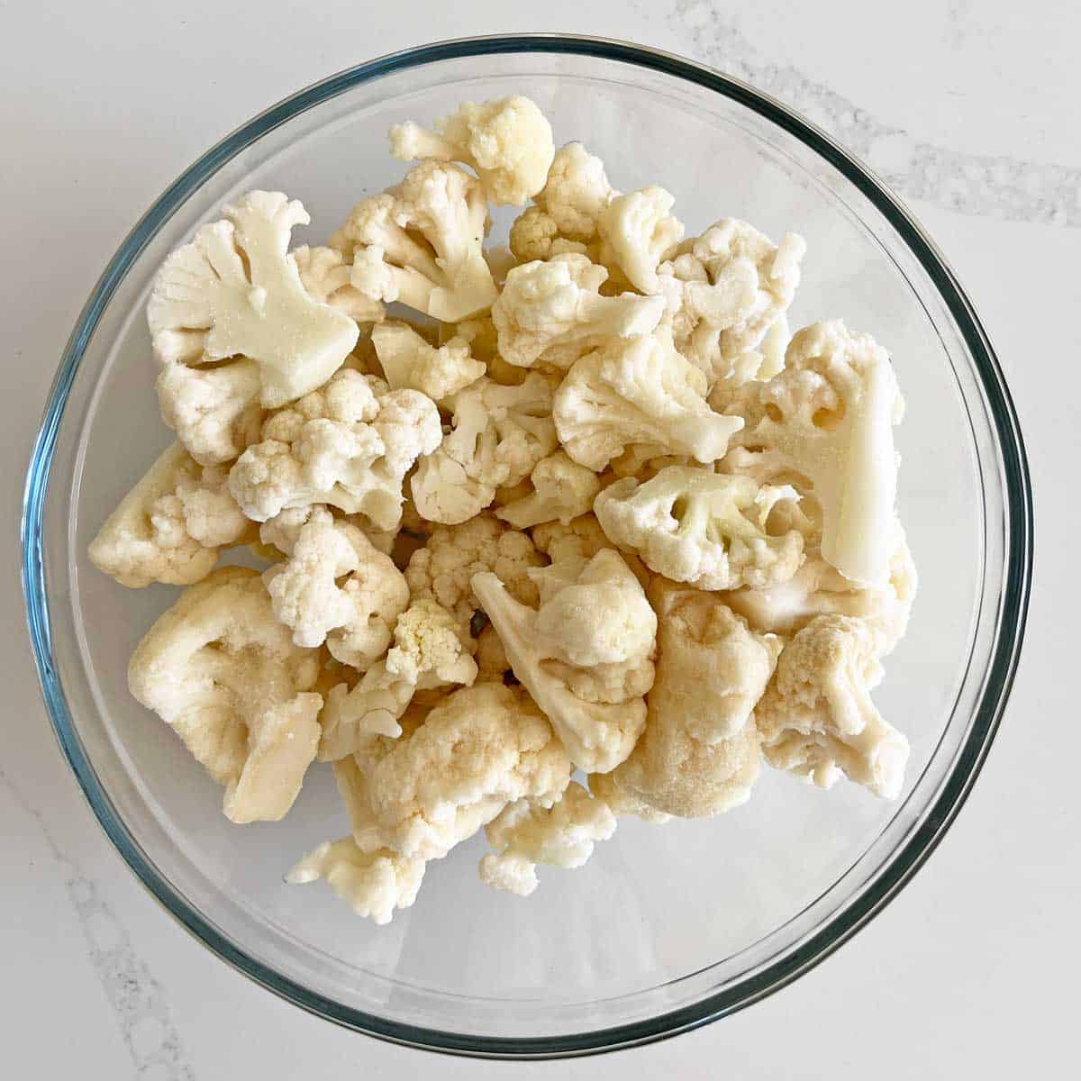 Frozen cauliflower florets in a bowl. 