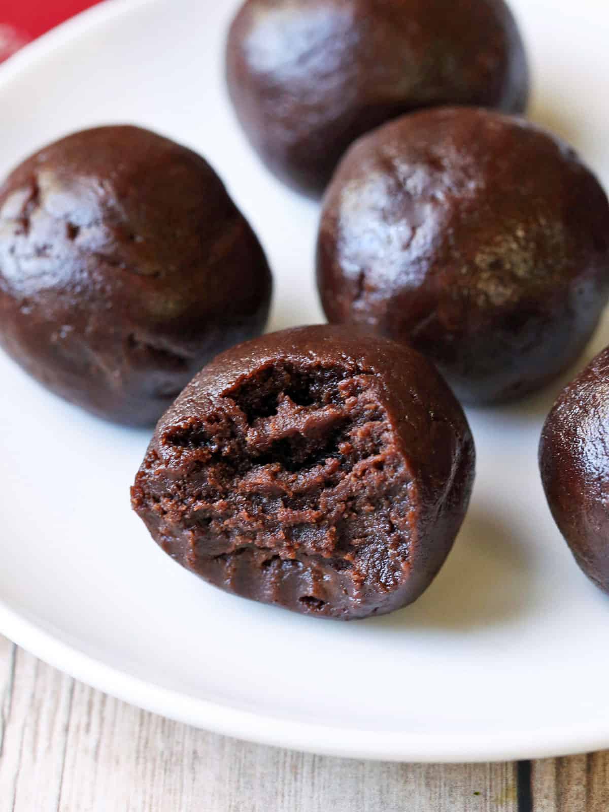 Keto fat bombs on a white plate. 