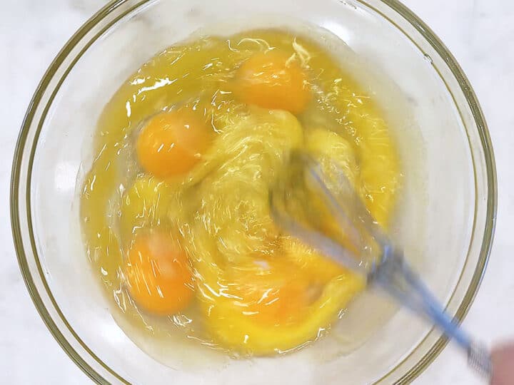 Whisking eggs, stevia, and melted butter.