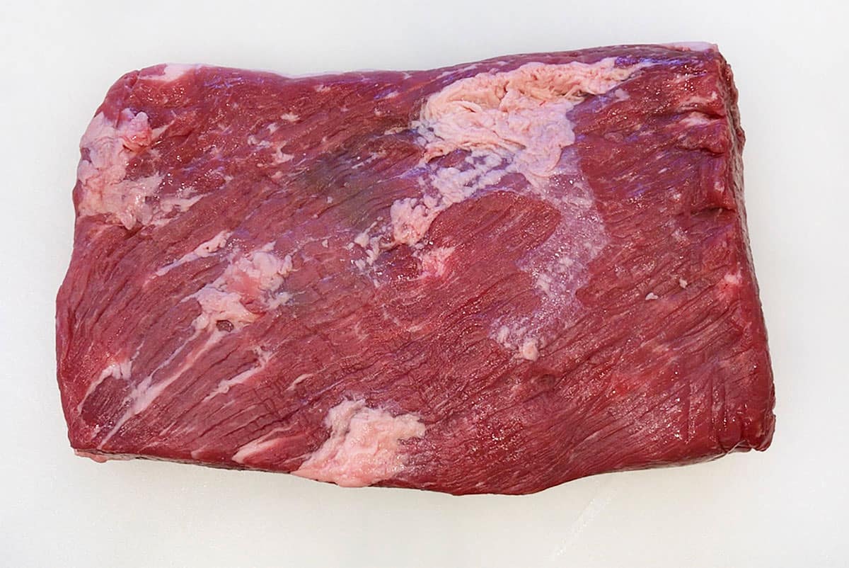 Brisket flat on a cutting board. 