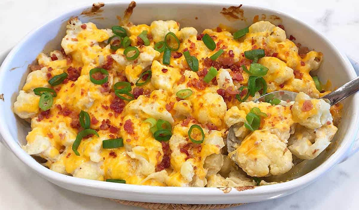 Serving cauliflower casserole. 
