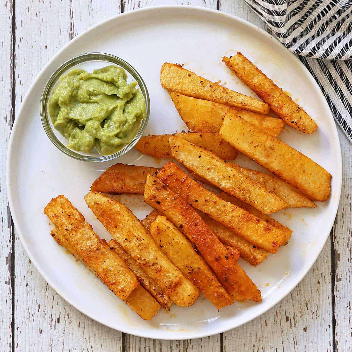 Jicama fries are served with guacamole. 