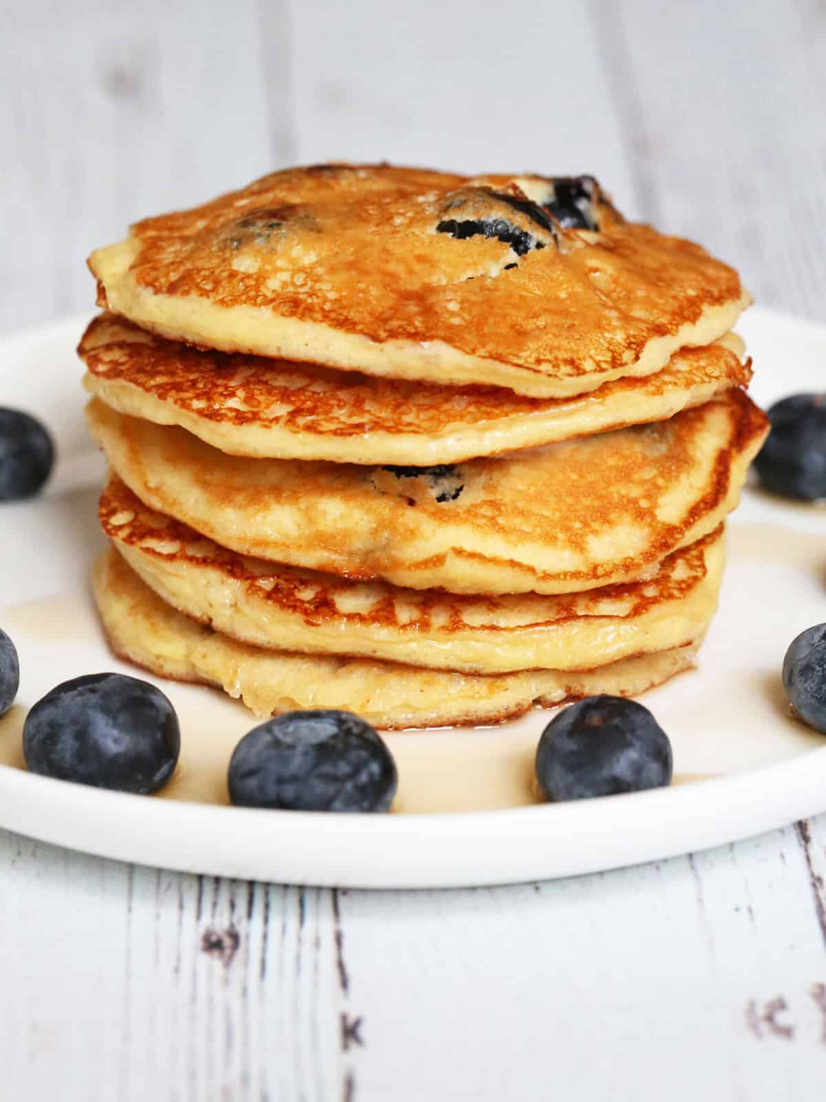 A stack of protein pancakes on a plate.