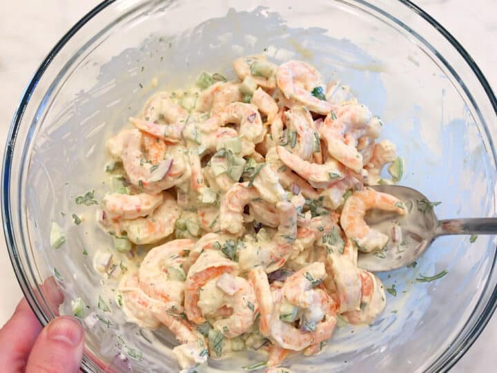 Mixing the salad.