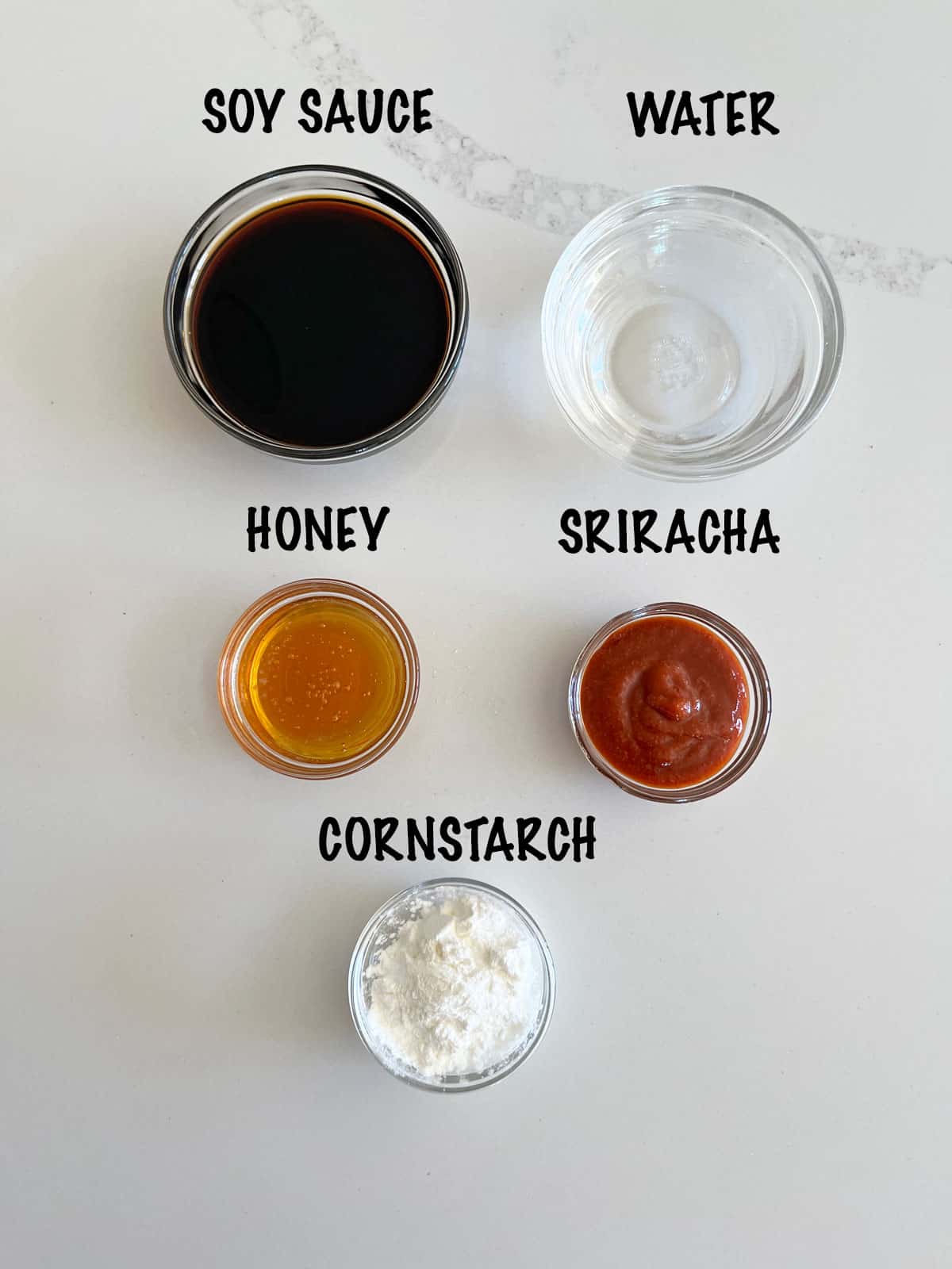 The ingredients needed to make the sauce for a pork stir fry.
