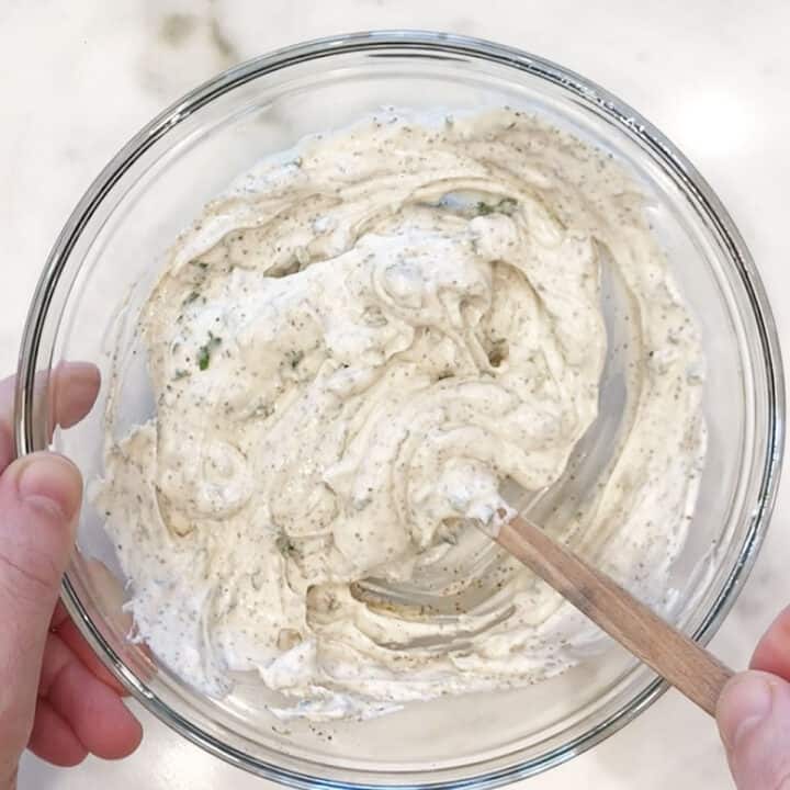 Mixing the dip ingredients in a bowl.