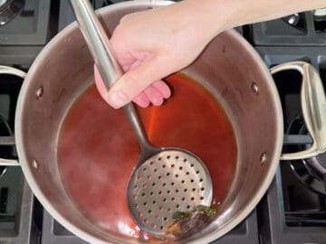 Straining the tea.