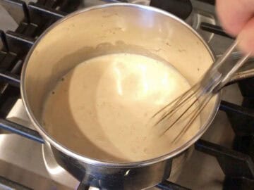 Whisking the sauce ingredients.