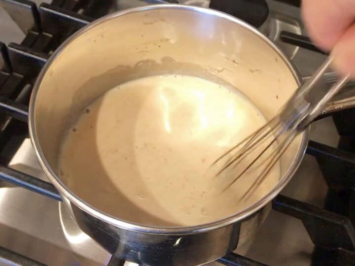 Whisking the sauce ingredients.