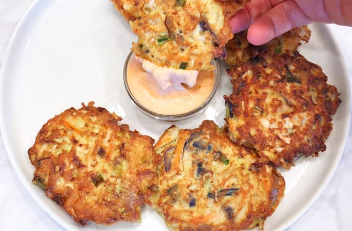 Dipping a cabbage pancake into the dip.