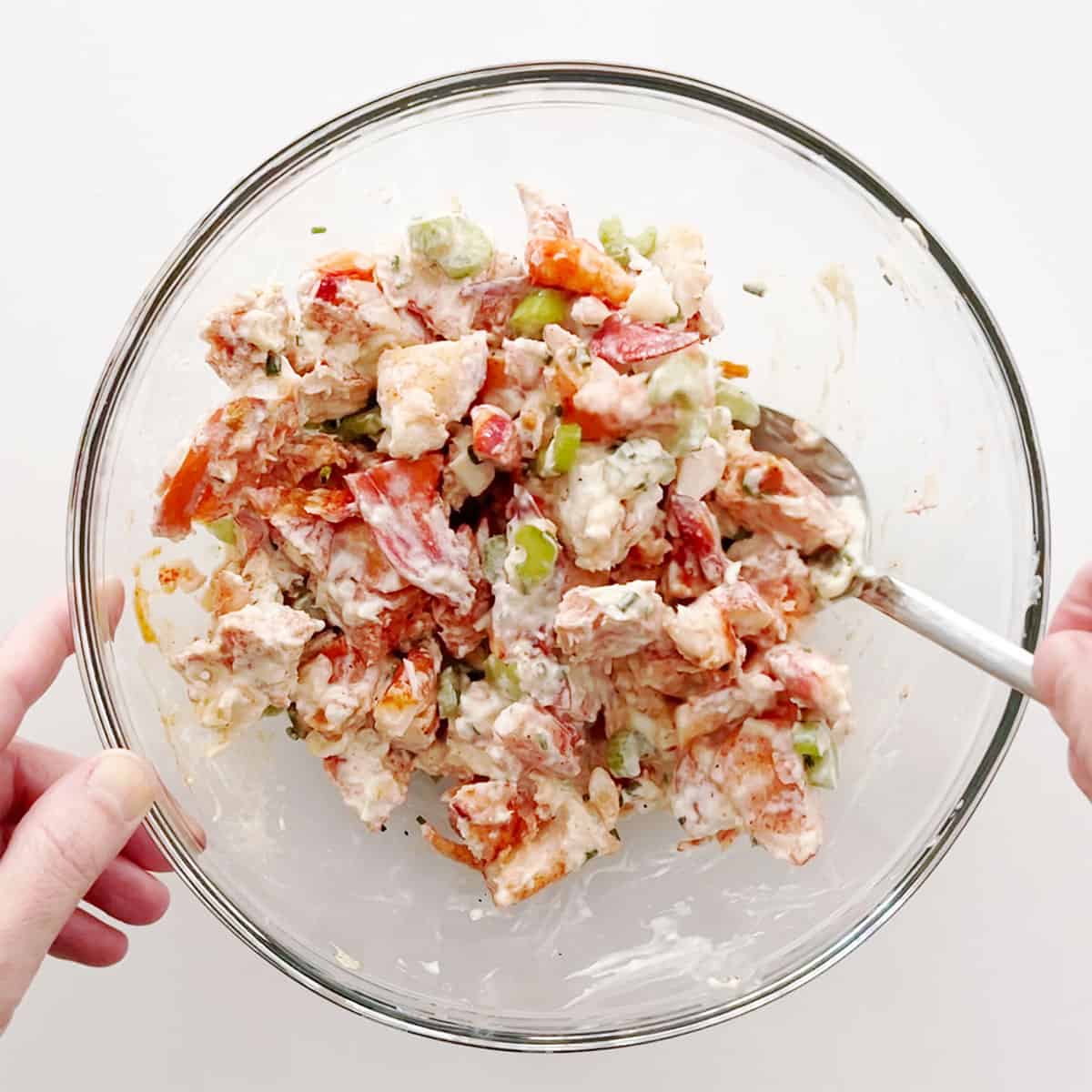 Mixing the salad.