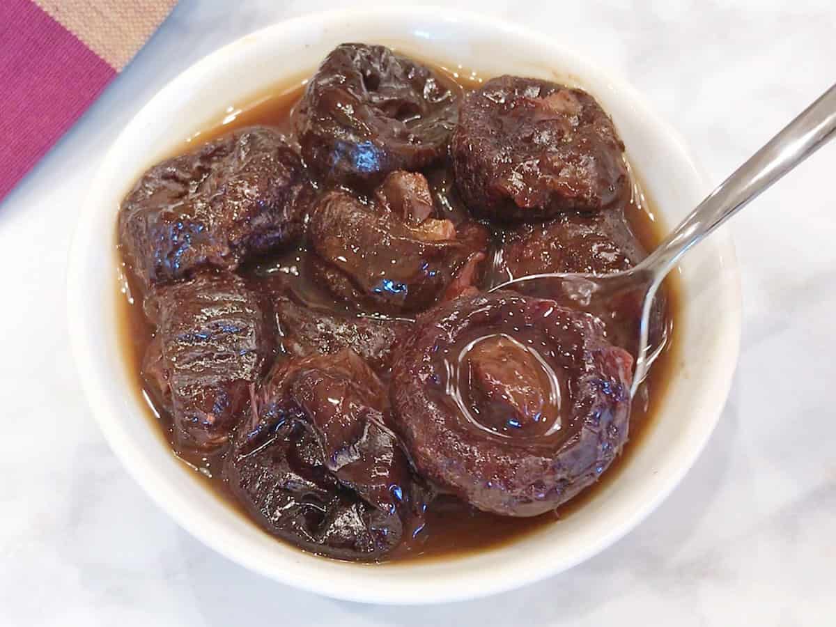 The stewed prunes are served.