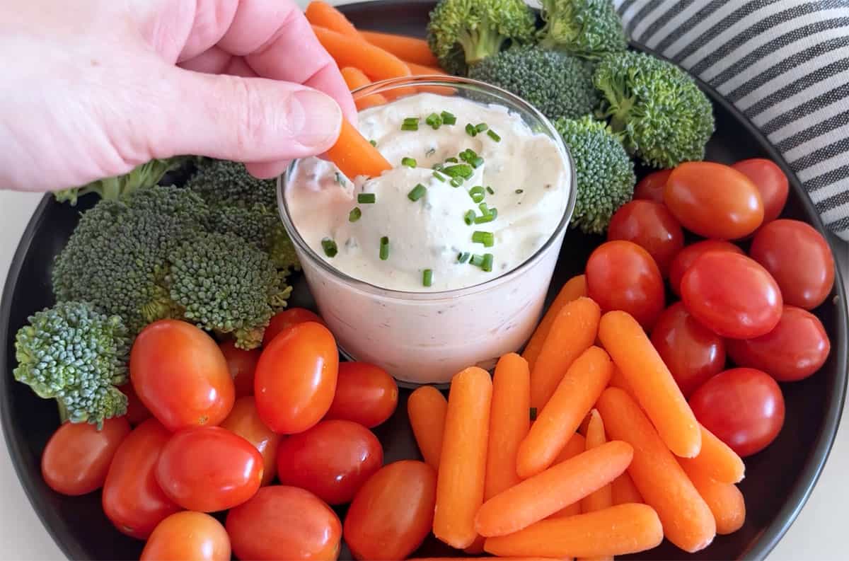 Serving the dip.