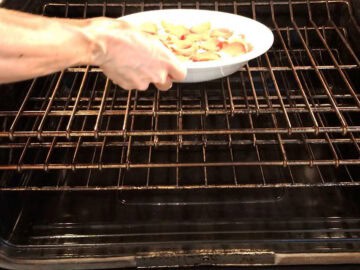 Placing the dip in the oven.
