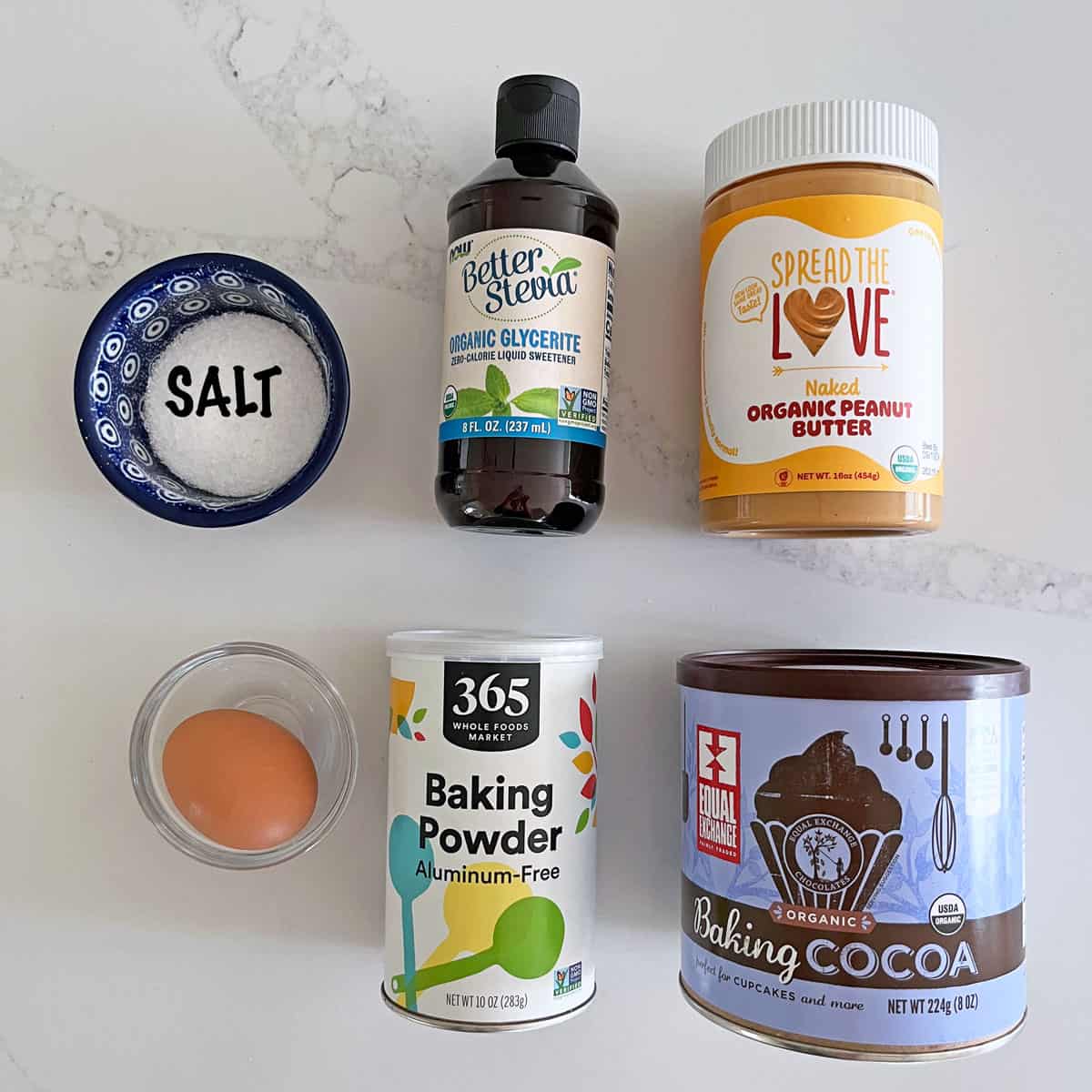 The ingredients needed to make a keto chocolate mug cake.