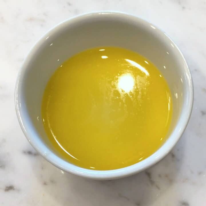 Melted butter in a ramekin.