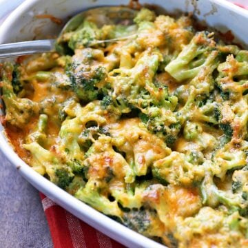 Broccoli casserole is served in a white baking dish.