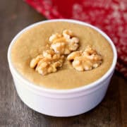 Walnut butter is served in a white bowl with a red napkin.
