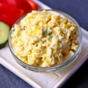 Keto egg salad is served with vegetables.