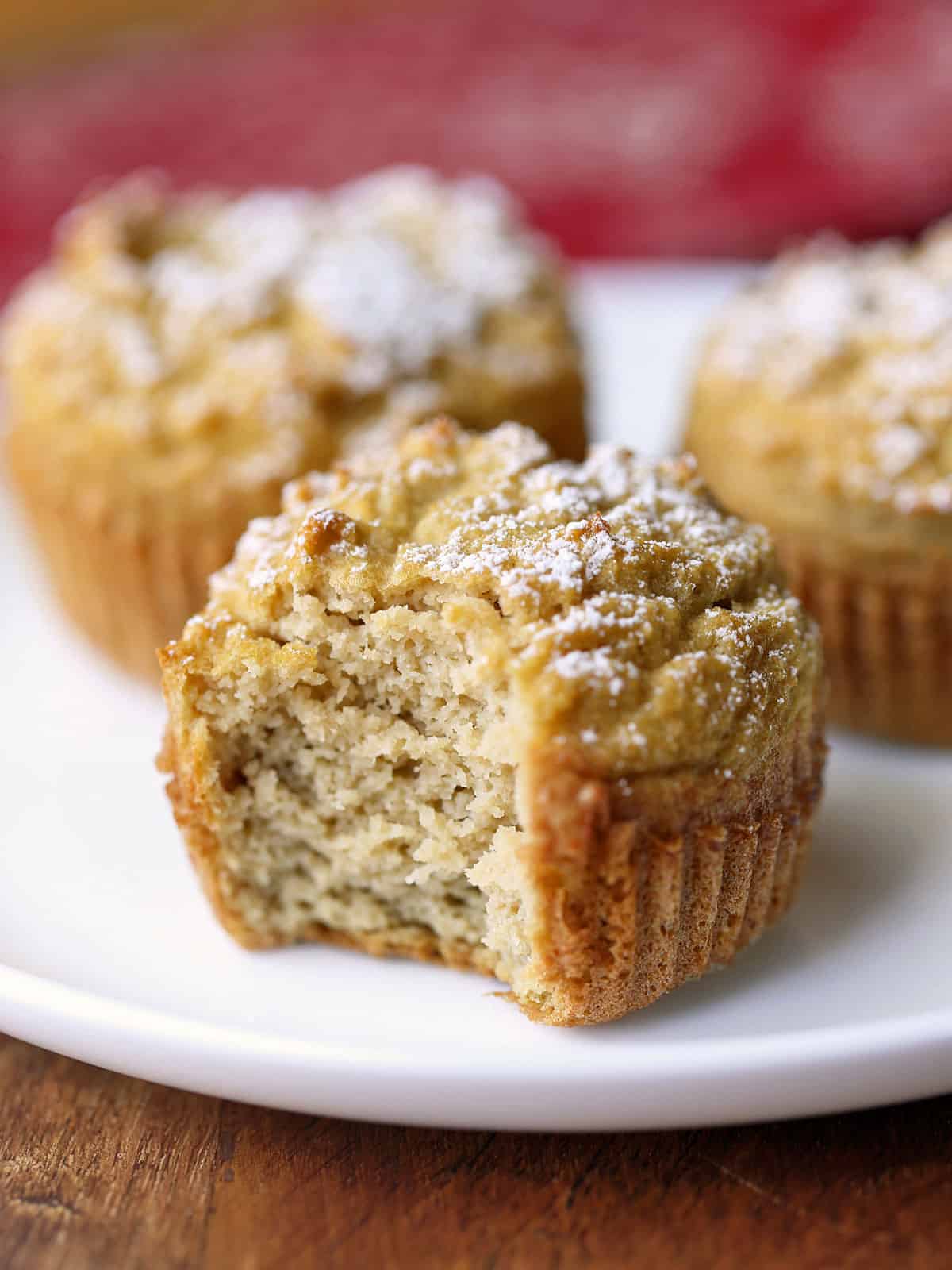 Coconut flour muffins are served on a white plate.