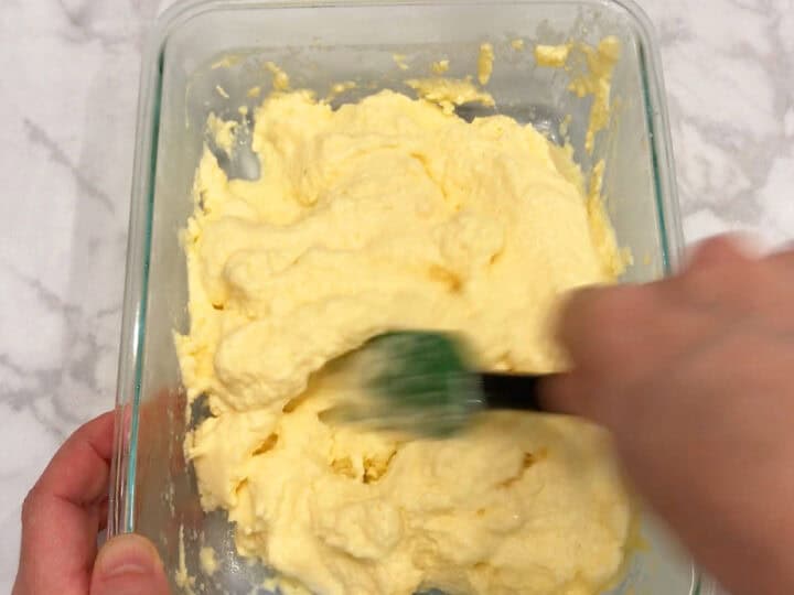 Stirring the yogurt.