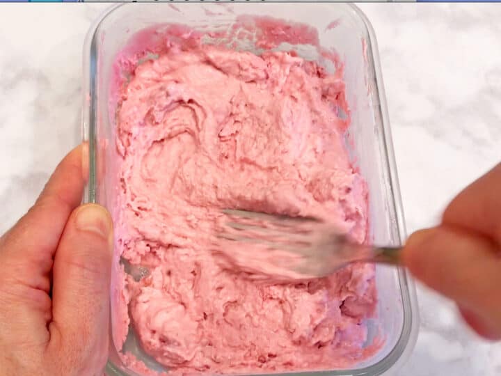 Stirring the yogurt.