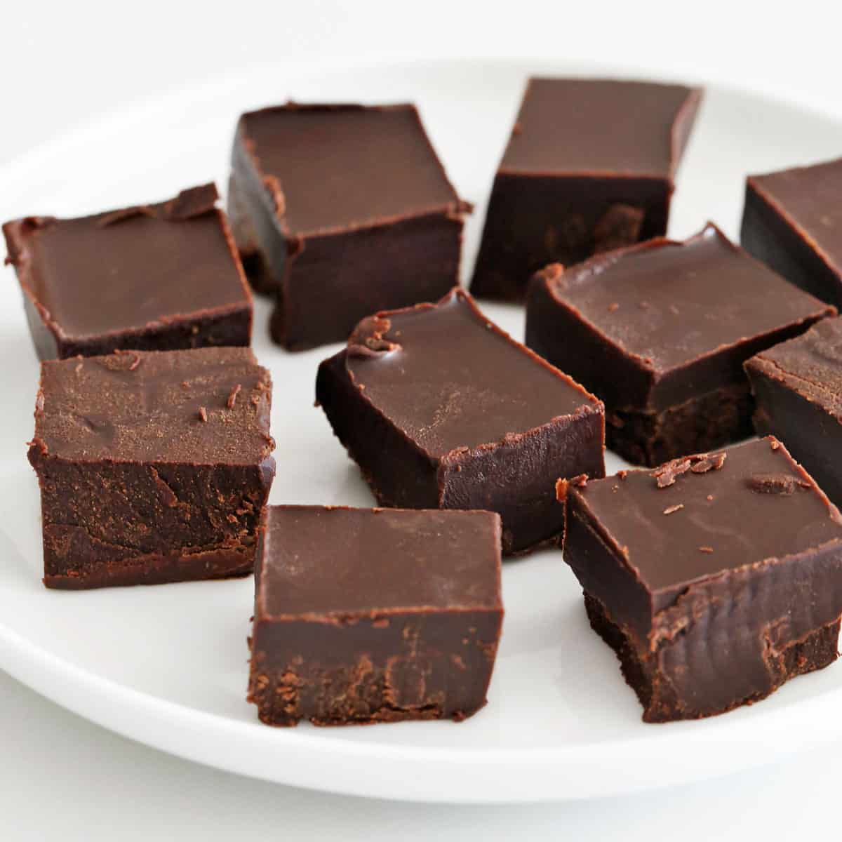 Keto fudge is served on a white plate.