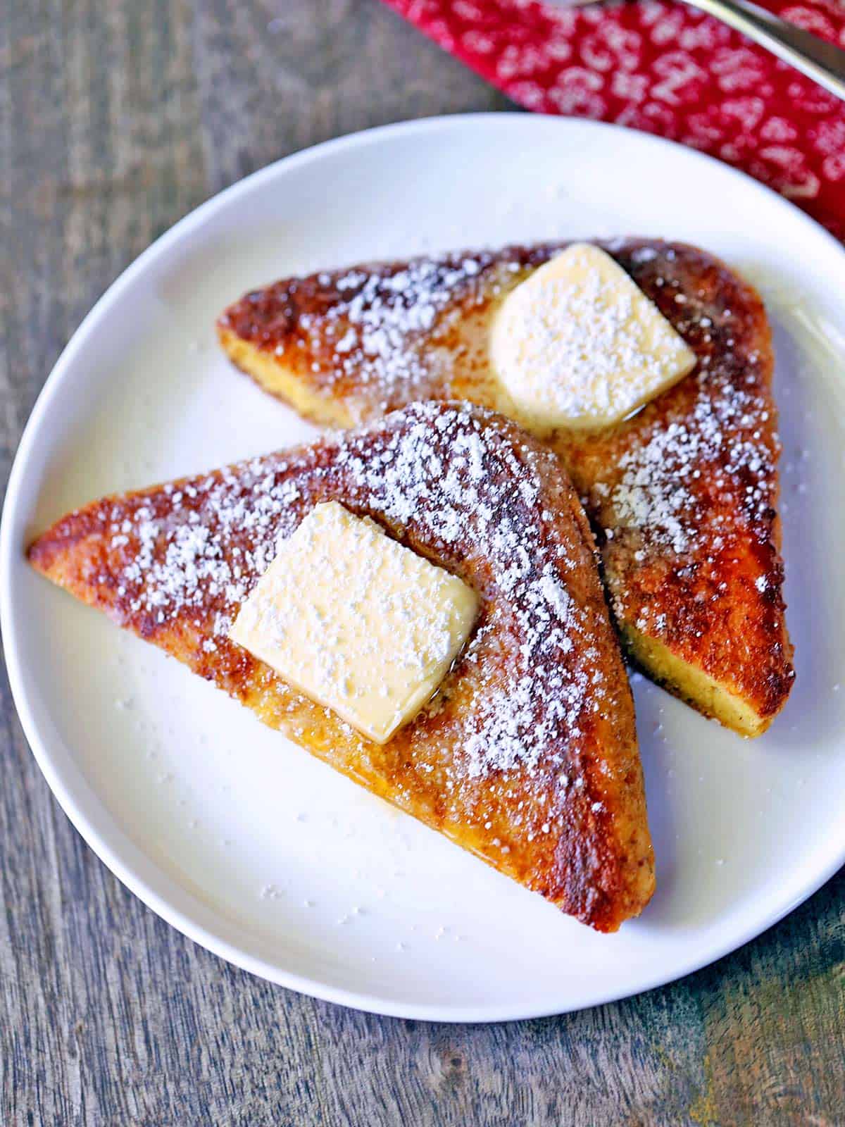 Keto French toast is served on a white plate.